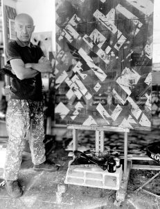 Self portrait in the workshop, April 2026.